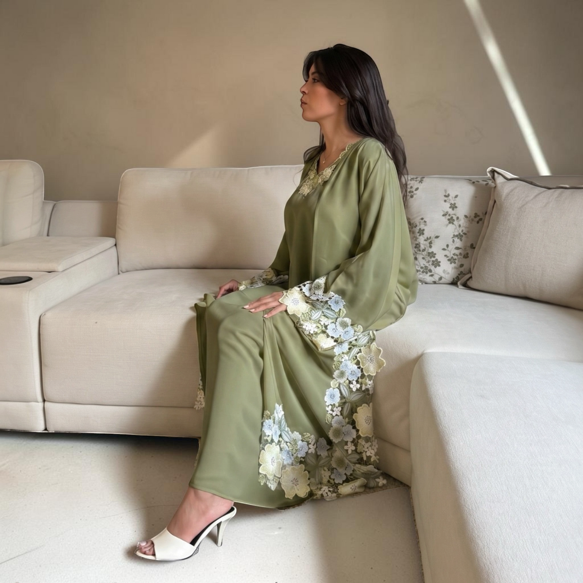 ABAYAS green Nida abaya with floral lace detailing on sleeves and hem, open-front silhouette.