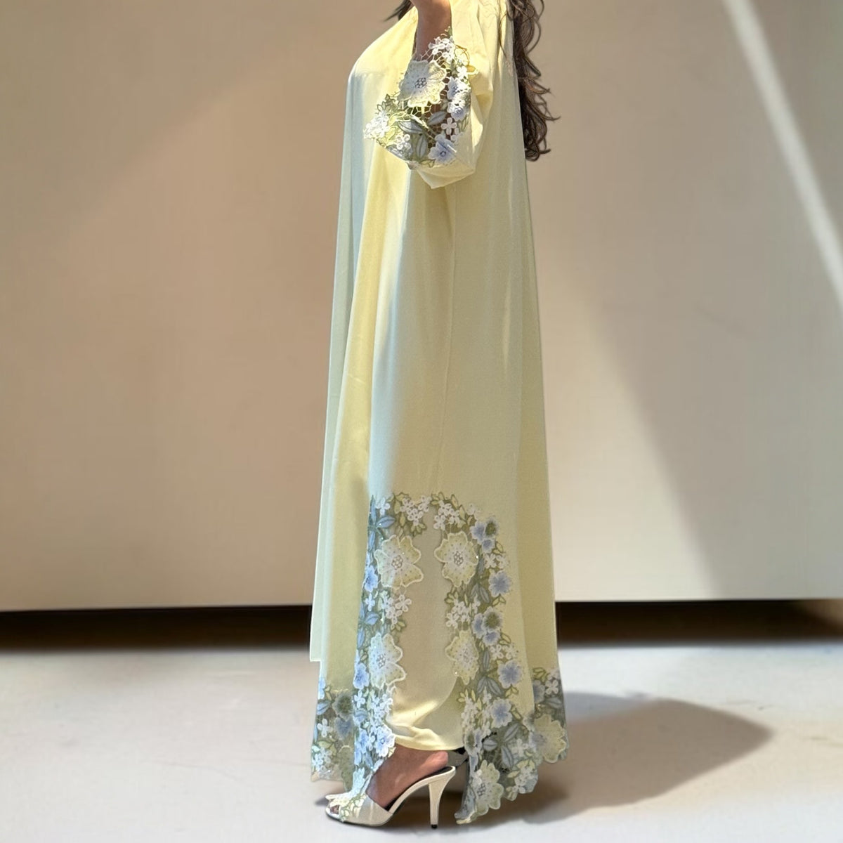 ABAYAS yellow Nida abaya with floral lace detailing on sleeves and hem, open-front design, includes inner dress.