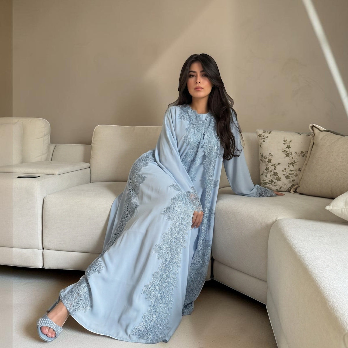 Light blue Nida fabric abaya with intricate floral lace and rhinestone embellishments on the neckline and sleeves. ABAYAS.