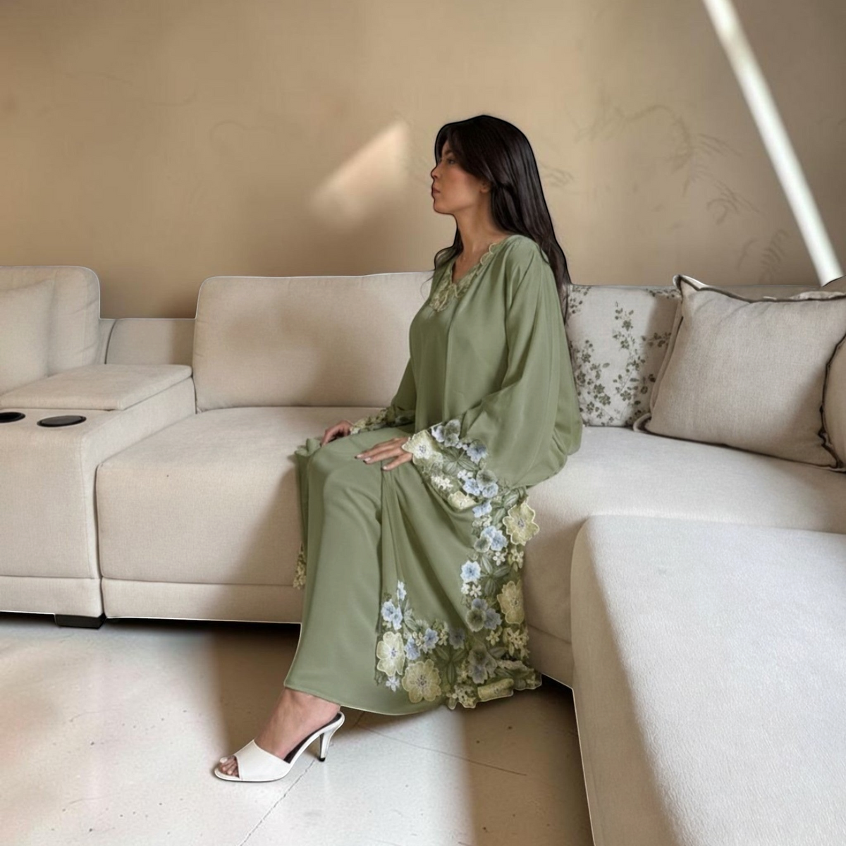 AbayasSh green Nida abaya with floral lace detailing on sleeves and hem. Open-front, fluid silhouette.